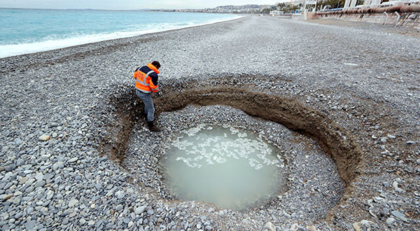 Big Crater Seen on Beach in French Riviera Big Crater Seen on Beach in French Riviera